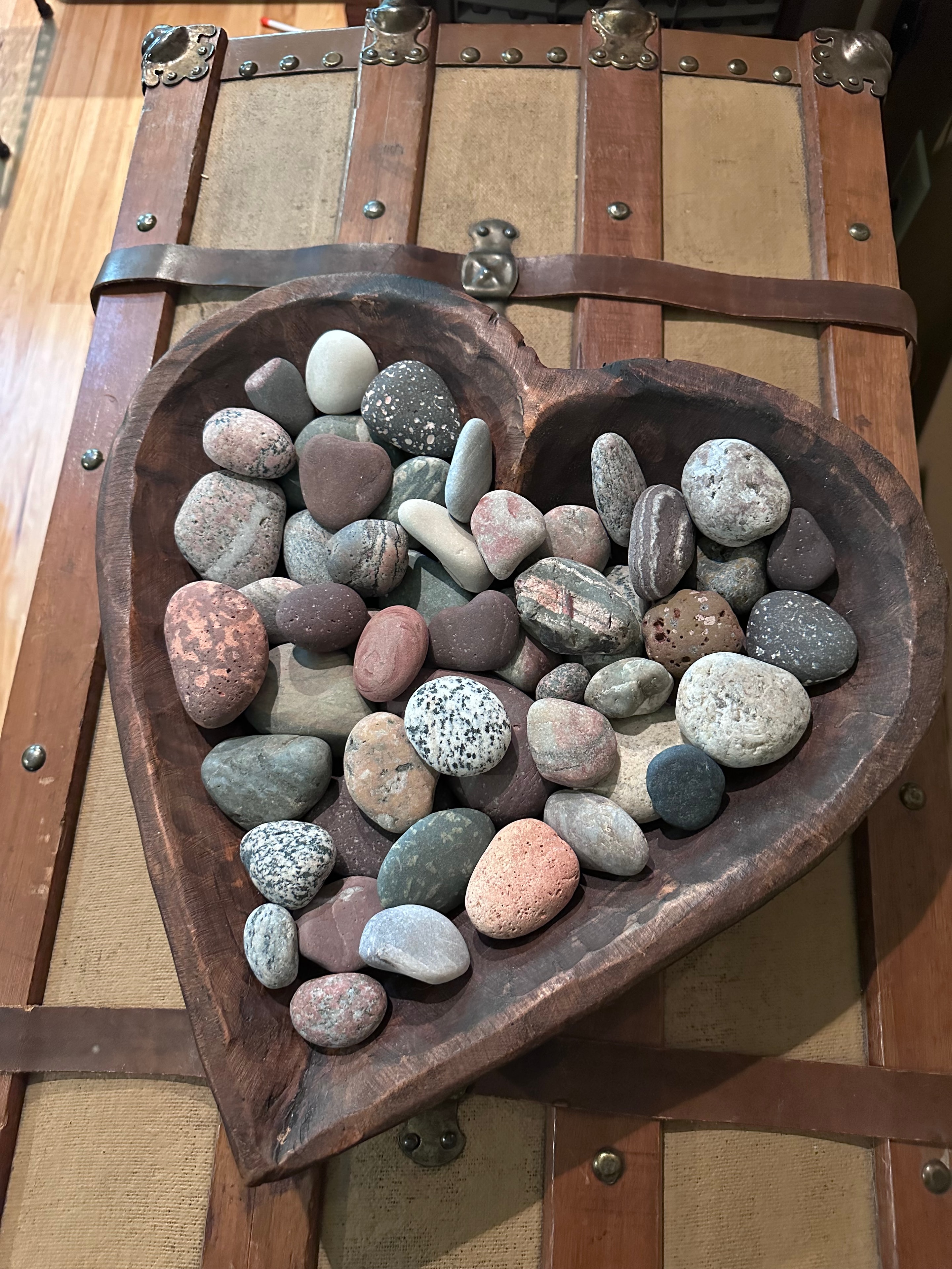 Lake Superior stones in a wooden heart-shaped bowl
