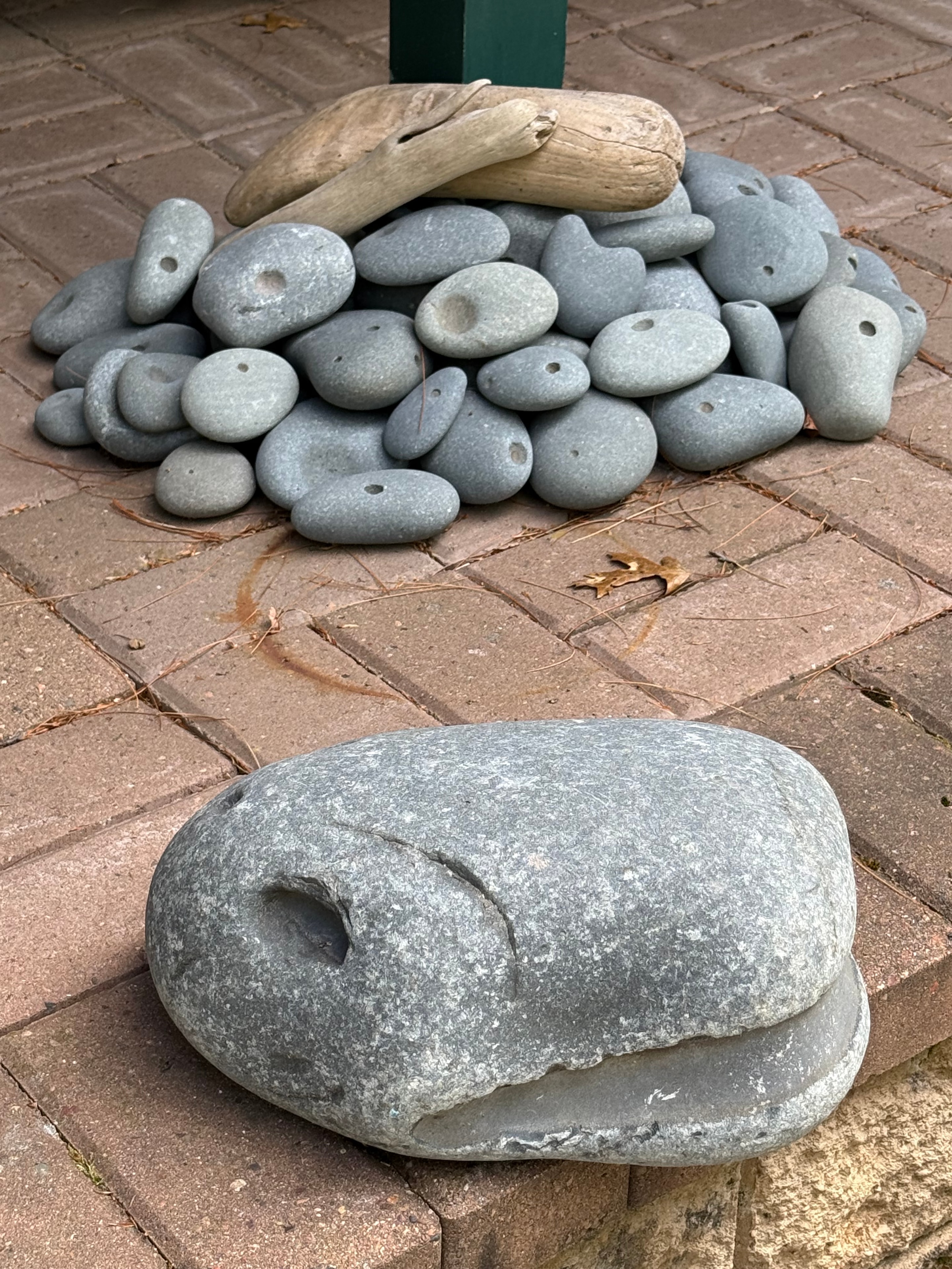 Omarolluk stones showing their distinctive smooth bowl-shaped pits and circular cavities